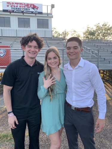 Ethan and Riley presenting Ramsie with her Senior Ring. 